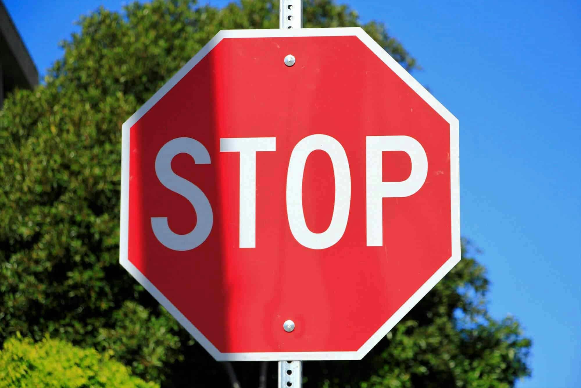 incomplete stops at stop signs result in an automatic fail