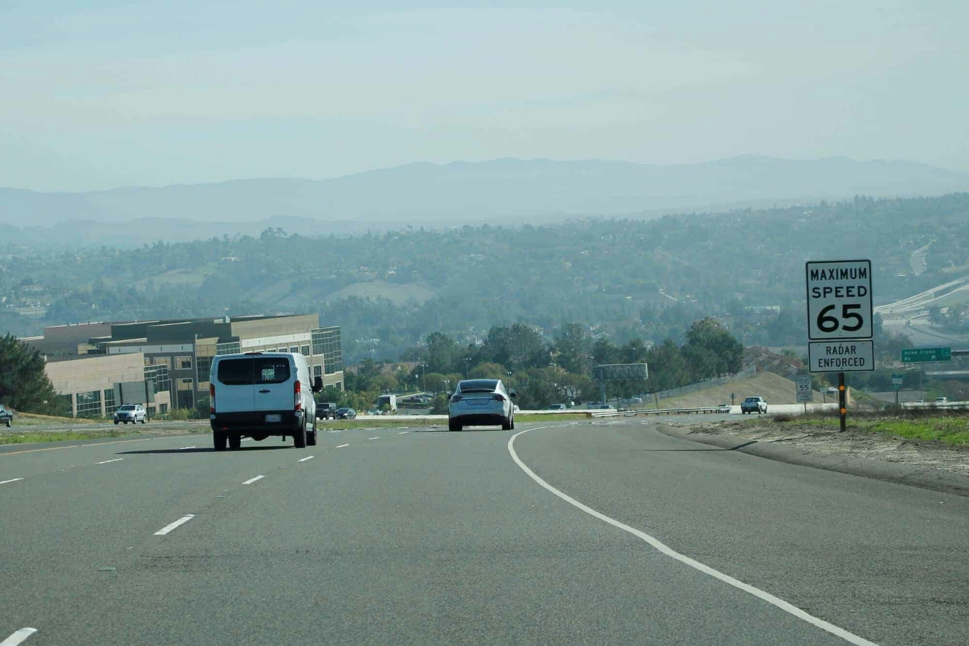 65 mph speed limit sign on freeway