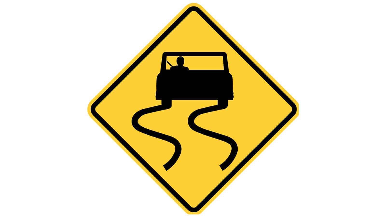 Warning sign Road Slippery When Wet