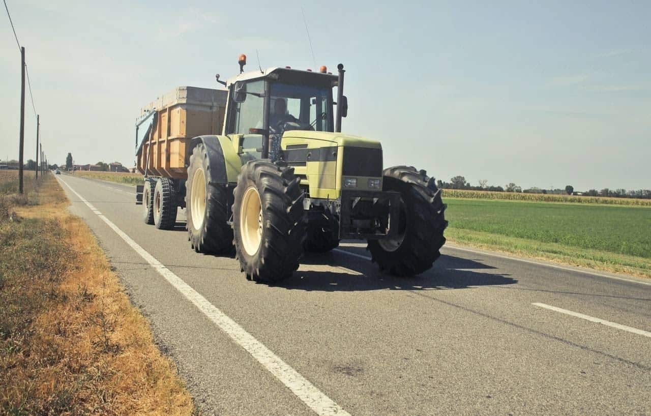 Slow moving vehicles, like tractors, may carry loads on the highway