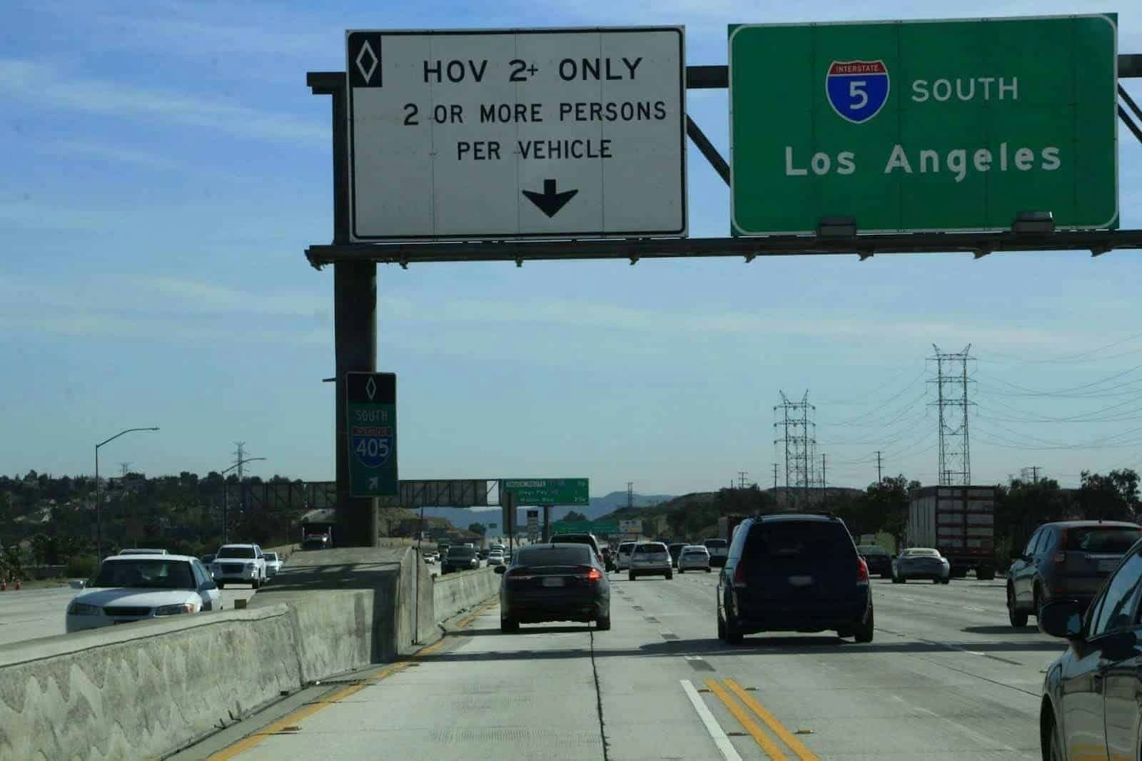Look for signs indicating who may drive in a HOV lane