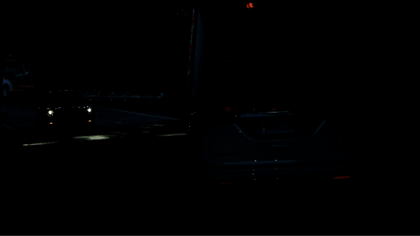 Can you spot the vehicle without lights on the right side of this picture?