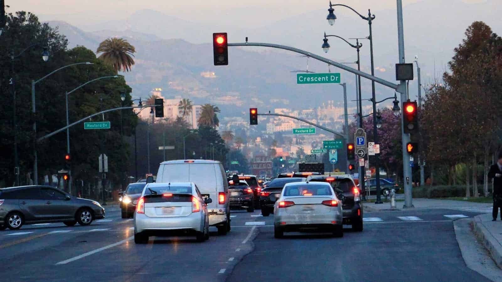 Cars waiting in front of red traffic lights