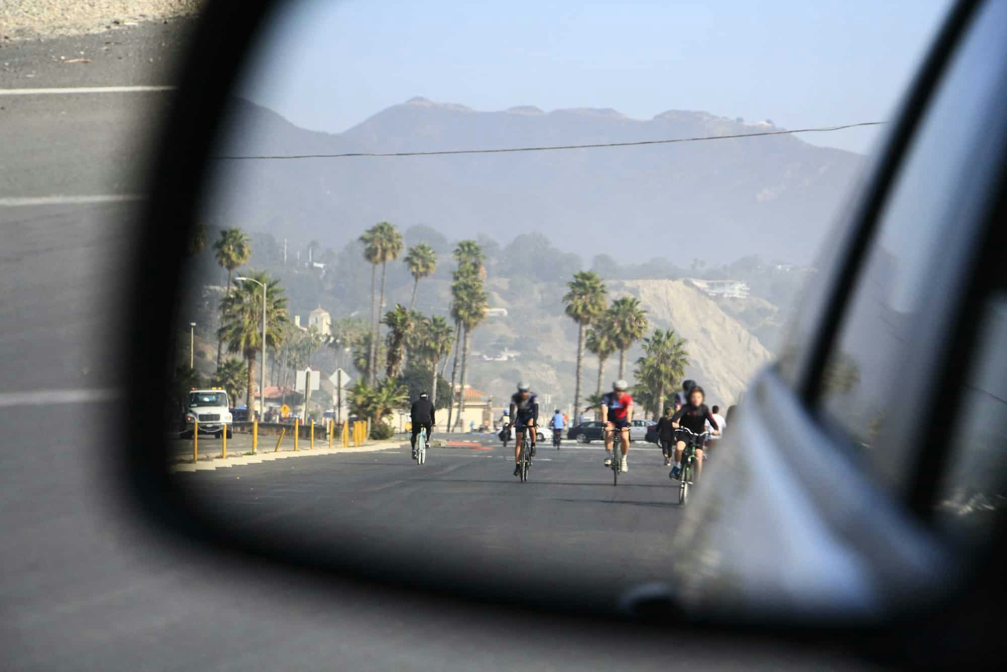 Cyclists in the car mirror