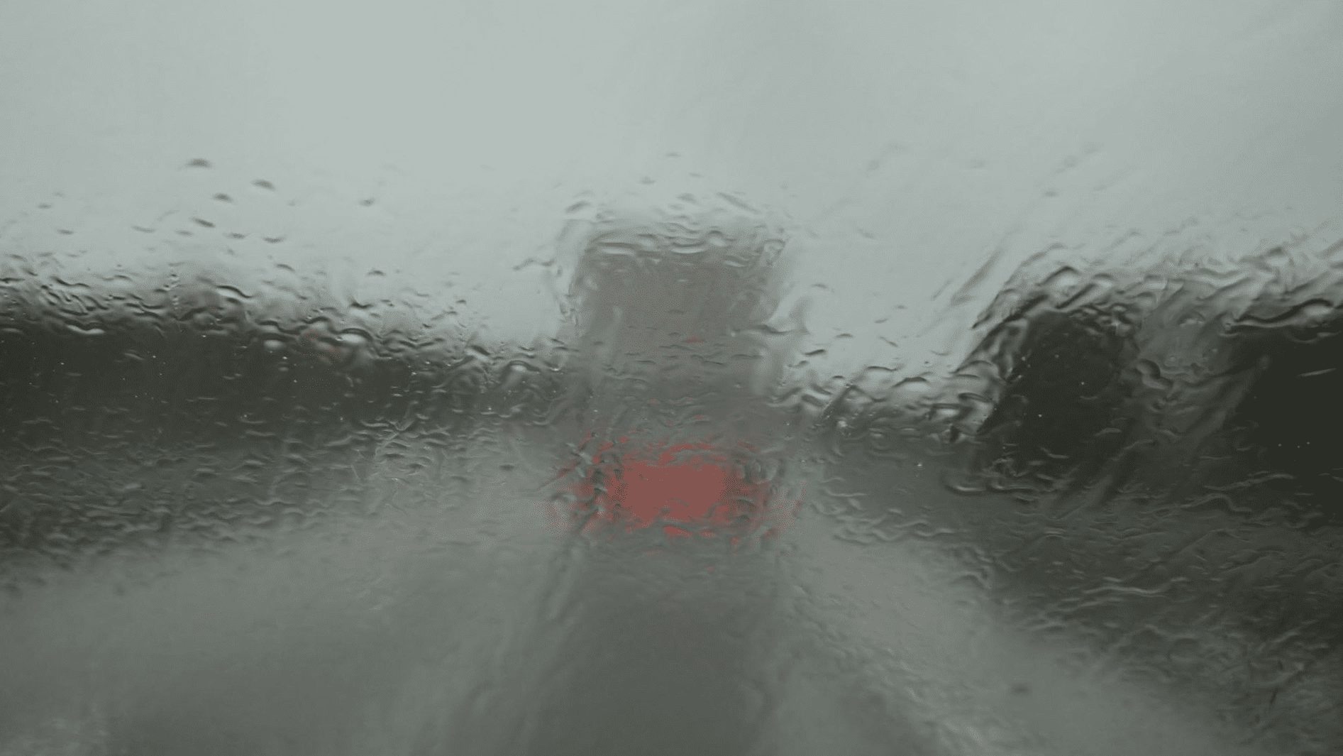Driving behind a truck on slippery road while raining