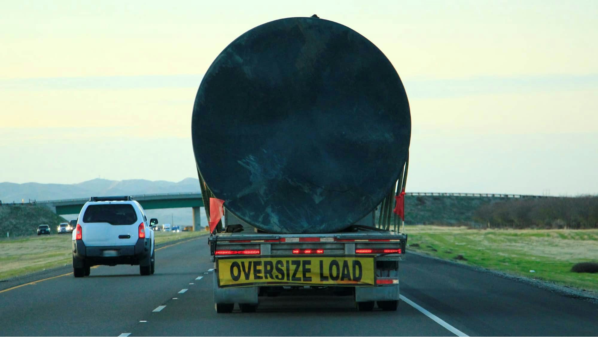 Oversize load CMV driving on freeway