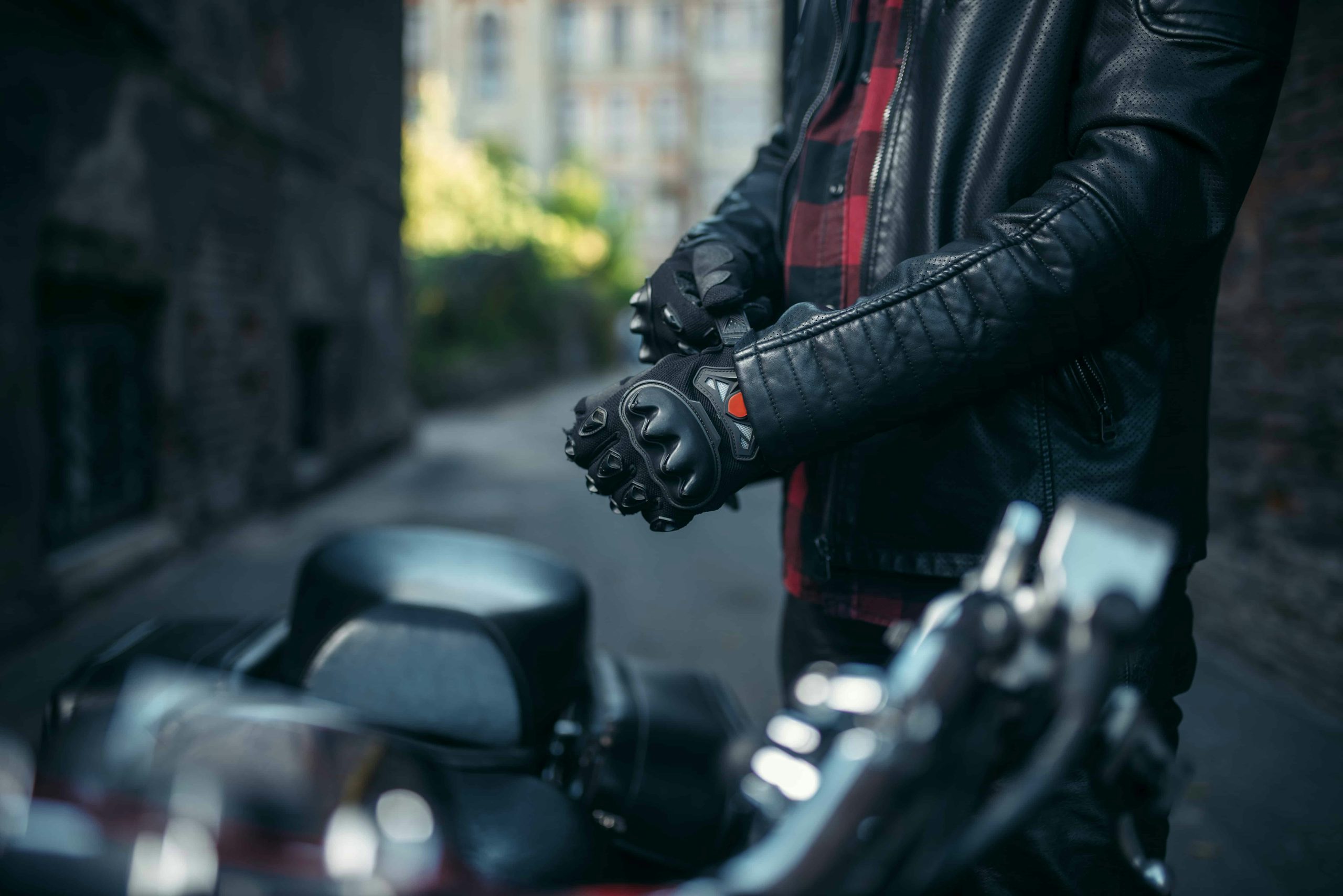 A motorcyclist wearing a leather jacket