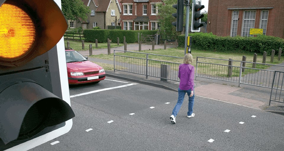 PEDESTRIAN CROSSING PELICAN CROSSING WHEN THE AMBER LIGHT IS FLASHING